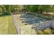 Well-maintained community tennis court with a fenced perimeter and lush surrounding greenery at 7945 Parklane Ct # C, North Charleston, SC 29418