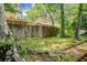 Residential backyard with a weathered wooden fence and mature trees providing ample shade and privacy at 7947 Vermont Rd, North Charleston, SC 29418