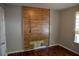 Blank bedroom with a wood accent wall at 7947 Vermont Rd, North Charleston, SC 29418
