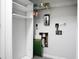 A laundry room area including a wire shelf, a dryer duct, and an electrical outlet at 7947 Vermont Rd, North Charleston, SC 29418