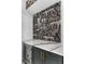 Bar featuring marble countertop, dark teal cabinets, and a black and white wallpapered background at 80 Smith St, Charleston, SC 29401