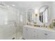 Stylish bathroom featuring a double vanity, gold fixtures, and a glass-enclosed shower at 80 Smith St, Charleston, SC 29401