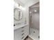 Modern bathroom featuring white cabinets, marble countertop, and glass shower at 80 Smith St, Charleston, SC 29401