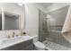 Modern bathroom with stylish vanity, glass-enclosed shower, and patterned tile flooring at 80 Smith St, Charleston, SC 29401