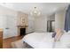 Comfortable bedroom showcasing a brick fireplace and neutral-toned walls and decor at 80 Smith St, Charleston, SC 29401