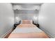 Cozy bedroom with stylish wallpaper, modern lighting, and a comfortable bed with decorative pillows at 80 Smith St, Charleston, SC 29401