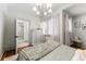 Comfortable bedroom featuring wood floors and a stylish light fixture at 80 Smith St, Charleston, SC 29401