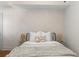 Relaxing bedroom showcasing a plush bed, patterned wallpaper, and soft, inviting lighting at 80 Smith St, Charleston, SC 29401
