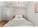 Peaceful bedroom with a cozy bed, patterned wallpaper, and a well-lit atmosphere at 80 Smith St, Charleston, SC 29401