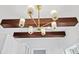 Modern chandelier on wood beams illuminates this kitchen at 80 Smith St, Charleston, SC 29401