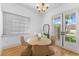 Bright dining area features hardwood floors, a round table, french doors and natural light at 80 Smith St, Charleston, SC 29401