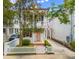 Charming two-story home with a white picket fence and inviting front porch and a pink front door at 80 Smith St, Charleston, SC 29401