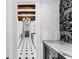 Hallway showcasing hardwood floors, beam ceilings, decorative wallpaper, and hallway views to the kitchen at 80 Smith St, Charleston, SC 29401