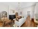 Inviting living room with stylish furnishings, a fireplace, hardwood floors, and natural lighting at 80 Smith St, Charleston, SC 29401