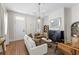 Beautiful living room features hardwood floors, fireplace, white couch and lots of natural light at 80 Smith St, Charleston, SC 29401