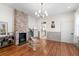 Inviting living room features a brick fireplace, hardwood floors and neutral color palette at 80 Smith St, Charleston, SC 29401