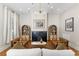 Cozy living room with fireplace, hardwood floors, stylish furnishings, and abundant natural light at 80 Smith St, Charleston, SC 29401