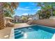 Backyard oasis with a sparkling pool, wooden deck, lounge chairs, and lush landscaping at 80 Smith St, Charleston, SC 29401