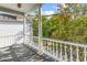 Inviting porch with white railing offering a view of lush greenery at 80 Smith St, Charleston, SC 29401
