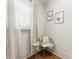 Cozy sitting area with a chair, side table, and natural light streaming through the window at 80 Smith St, Charleston, SC 29401