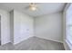 Bedroom boasts neutral paint, carpet, closet, and natural light from the window at 8028 Vermont Rd, North Charleston, SC 29418