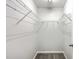 Walk-in closet featuring white walls, gray carpeting, and wrap-around wire shelving at 8028 Vermont Rd, North Charleston, SC 29418