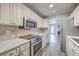 Well-equipped kitchen featuring stainless steel appliances, granite countertops, and ample cabinet space at 8028 Vermont Rd, North Charleston, SC 29418