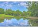 Beautiful pond view featuring the sky reflected in the clear water at 8028 Vermont Rd, North Charleston, SC 29418