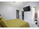 Bright bedroom with a TV, closet, and ensuite bathroom at 8096 Shadow Oak Dr Dr, North Charleston, SC 29406