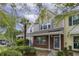Charming townhome with brick accents, colorful shutters, and lush landscaping at 8096 Shadow Oak Dr Dr, North Charleston, SC 29406