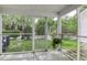 Screened porch with a view of the yard at 8096 Shadow Oak Dr Dr, North Charleston, SC 29406