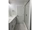 Bright bathroom with a double sink vanity, framed shower, and tile flooring at 819 Burger St, Charleston, SC 29407