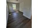 Bedroom featuring modern wood flooring, a window, and neutral wall paint at 819 Burger St, Charleston, SC 29407