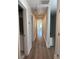 Bright hallway with hardwood floors that leads to another room in the house at 819 Burger St, Charleston, SC 29407
