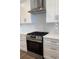 Close-up of a stainless steel gas stove and range hood at 819 Burger St, Charleston, SC 29407