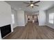 Spacious open-concept living area with fireplace flowing into a modern kitchen at 819 Burger St, Charleston, SC 29407