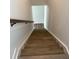 Wooden staircase with a handrail leading to the lower level of the home at 819 Burger St, Charleston, SC 29407