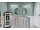 Bathroom features dual sinks, cabinet storage and modern fixtures at 8346 Chisolm Plantation Rd, Edisto Island, SC 29438