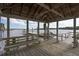 Beautiful view from the covered dock overlooking the river, offering shade and seating at 8346 Chisolm Plantation Rd, Edisto Island, SC 29438