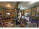 Well-lit garage featuring ample storage space, a workbench, and an air conditioning unit for comfortable projects at 8346 Chisolm Plantation Rd, Edisto Island, SC 29438