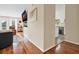 Open living space with hardwood floors, a mounted TV, and easy access to the kitchen at 8346 Chisolm Plantation Rd, Edisto Island, SC 29438