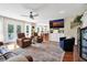 Bright and spacious living room with hardwood floors, neutral walls, and large windows offering natural light at 8346 Chisolm Plantation Rd, Edisto Island, SC 29438