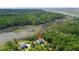 Aerial view of home, lush landscaping, marsh views and close proximity to the river and community at 8970 Palmetto Rd, Edisto Island, SC 29438