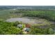 Scenic aerial view showcasing the property nestled amongst lush trees and tranquil waters at 8970 Palmetto Rd, Edisto Island, SC 29438