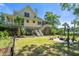 Well-maintained backyard featuring a patio with an outdoor seating area and a beautiful view at 8970 Palmetto Rd, Edisto Island, SC 29438