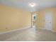 Bright bedroom featuring a large window with carpeting and neutral paint color at 8970 Palmetto Rd, Edisto Island, SC 29438