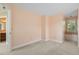Neutral-toned bedroom featuring carpet, a large window, and a reading nook at 8970 Palmetto Rd, Edisto Island, SC 29438