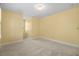 Spacious bedroom with neutral carpet and light yellow walls, offering a bright and airy feel at 8970 Palmetto Rd, Edisto Island, SC 29438