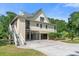 Home with spacious carport and stairs to a screened-in porch, blending convenience with outdoor living at 8970 Palmetto Rd, Edisto Island, SC 29438