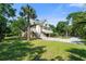 Charming home with large yard and palm trees, perfect for enjoying the outdoors and southern living at 8970 Palmetto Rd, Edisto Island, SC 29438